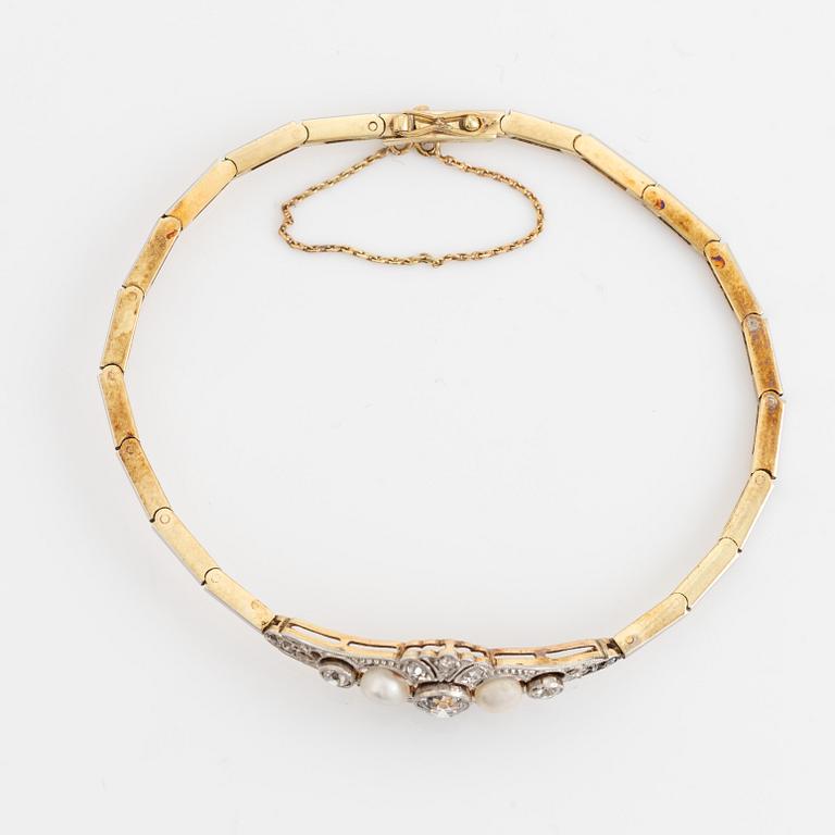 A 14K gold and platinum bracelet set with old- and rose-cut diamonds and pearls.
