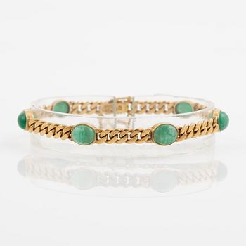 Bracelet in 18K gold with cabochon-cut emeralds, 1920s.