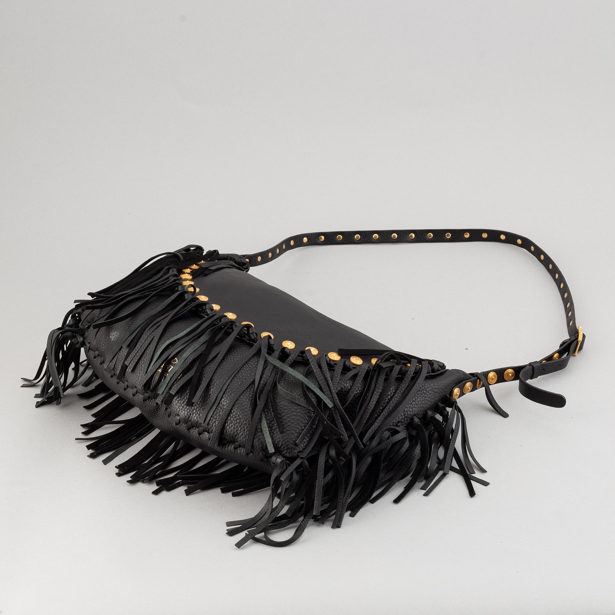 Valentino, a black leather hobo bag.