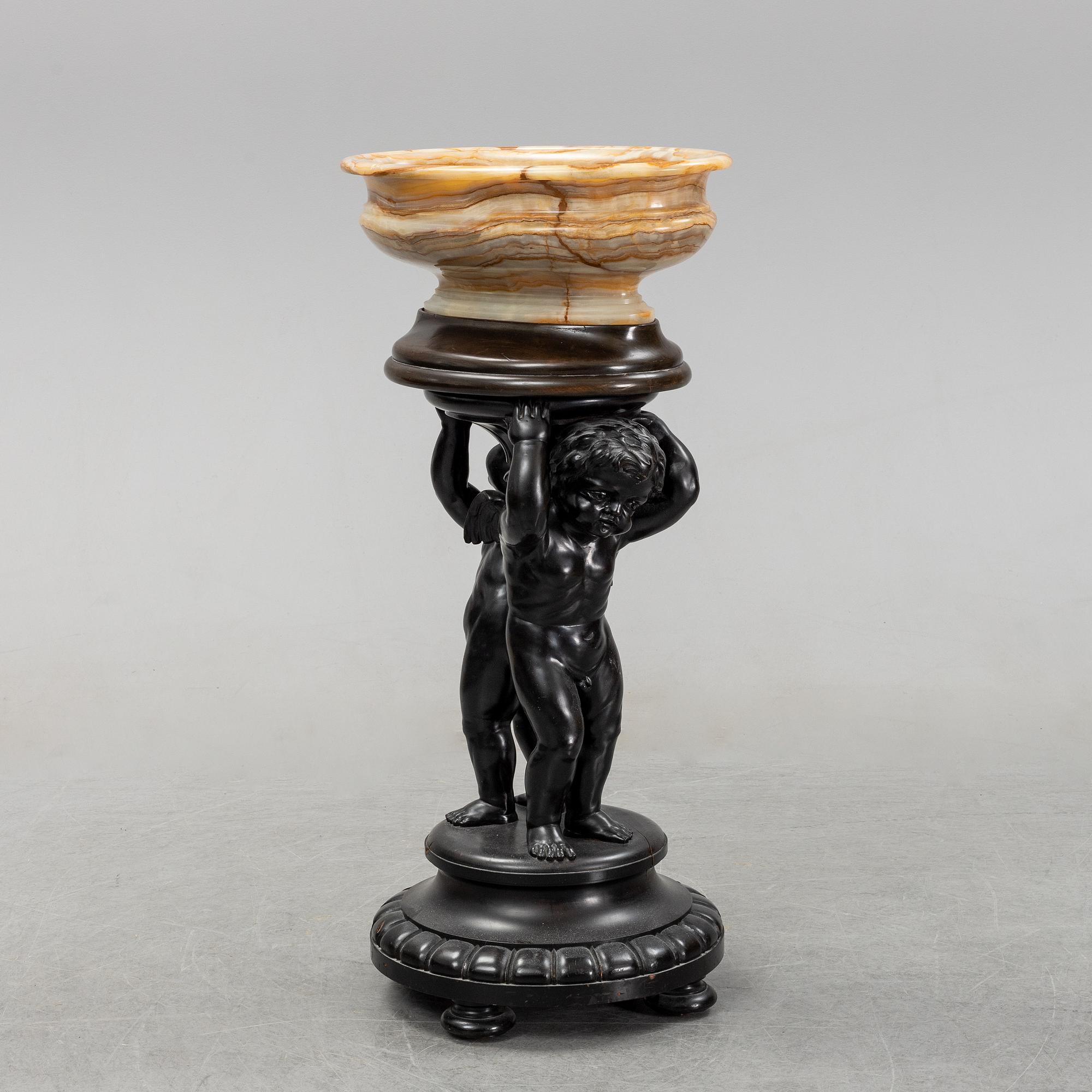 A wooden pedestal with onyx bowl, 20th Century.