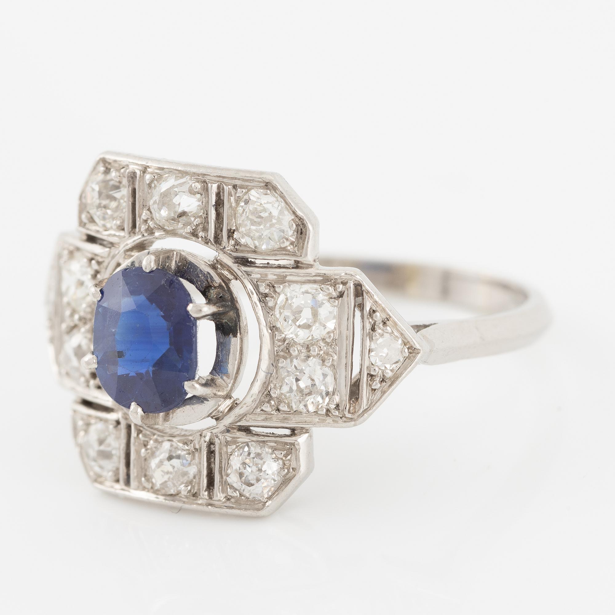 Platinum ring with sapphire and old-cut diamonds.