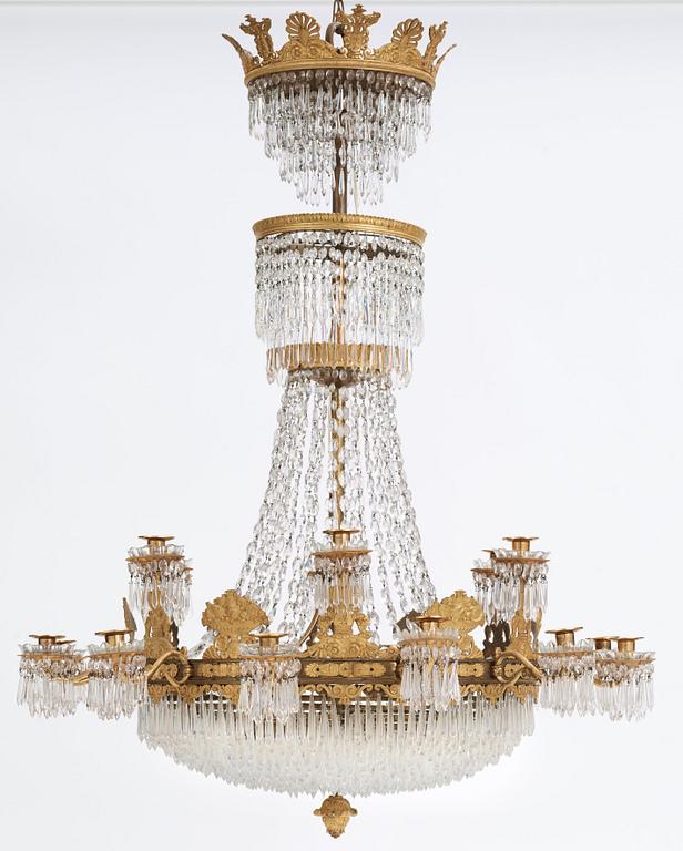 An Empire first half 19th century eighteen-light gilt bronze chandelier.