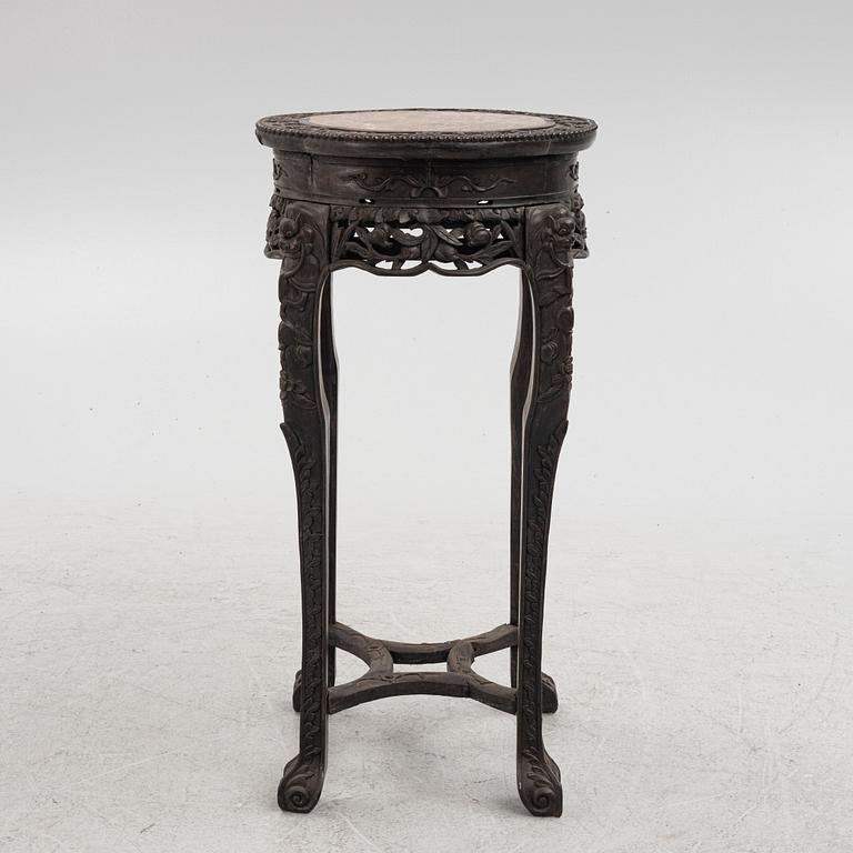 A Chinese wooden and stone table, 20th century.