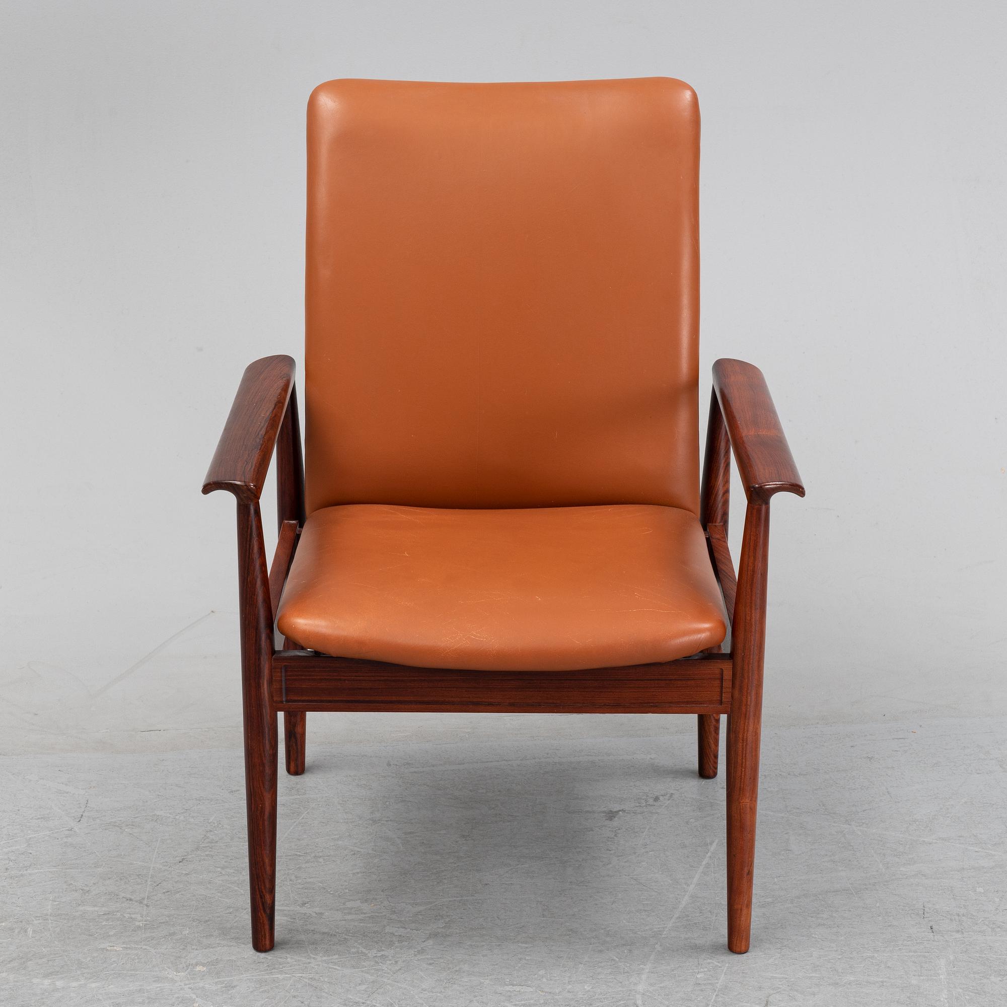 Finn Juhl, a rosewood easy chair, from Cado, Denmark, 1960's/70's.