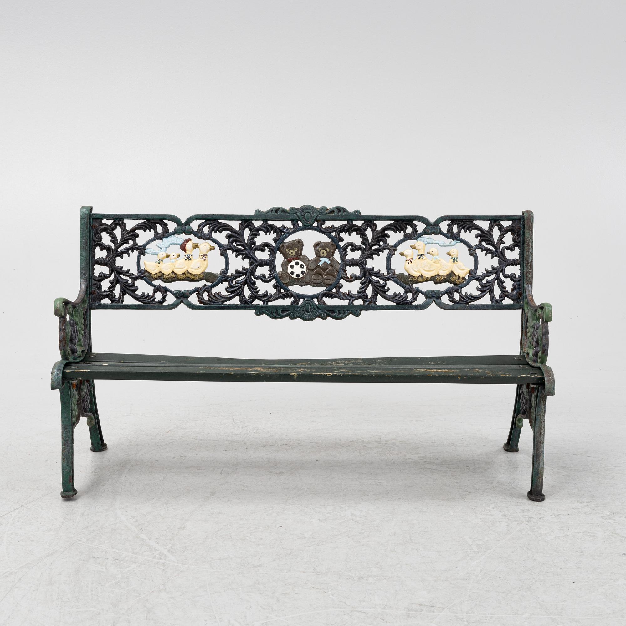 A children's cast iron garden sofa and armchair, mid 20th century.