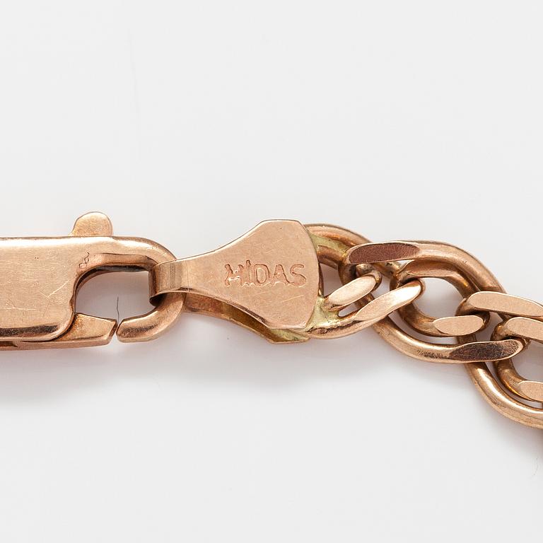 A 14K gold bracelet. Marked Midas.