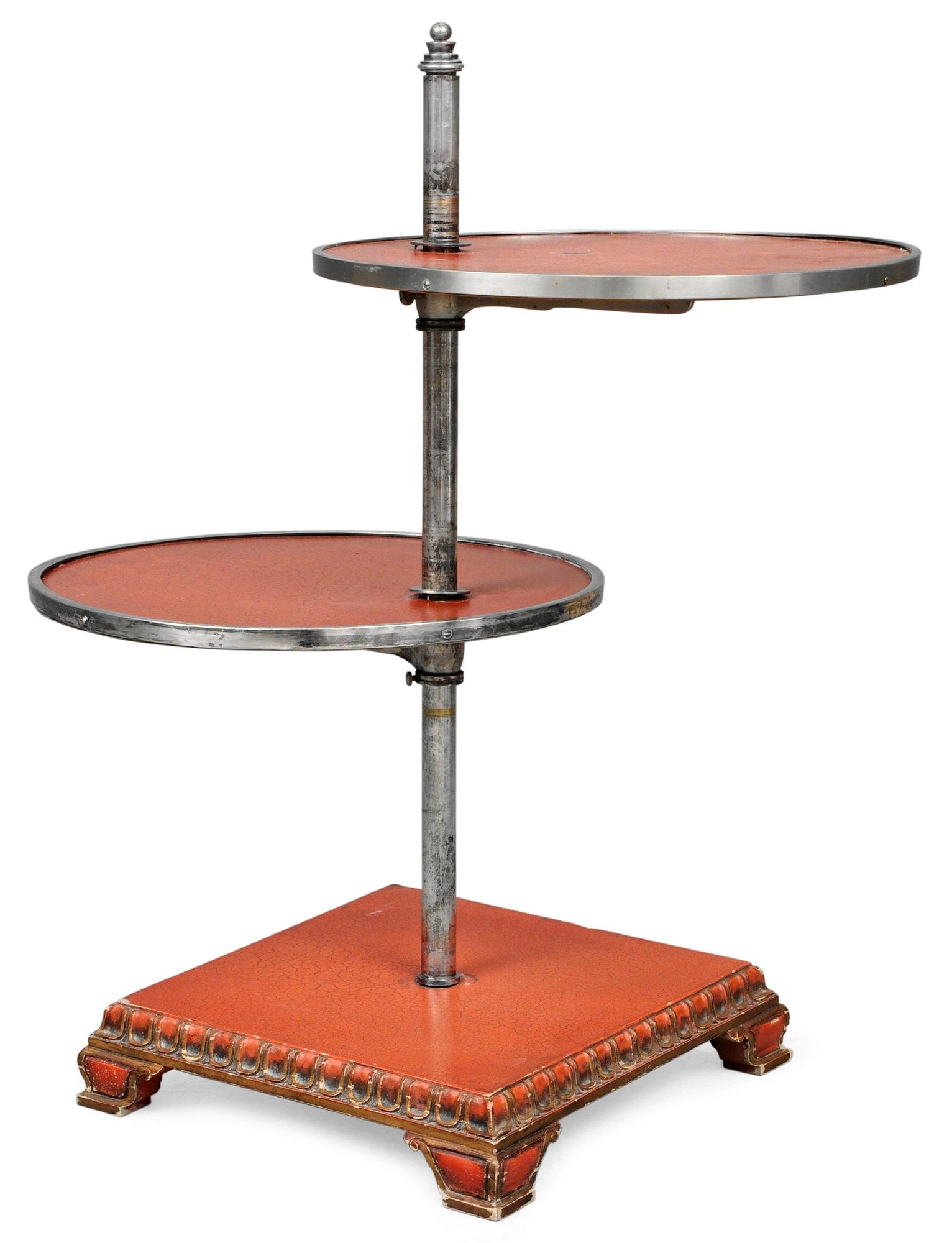 An Axel-Einar Hjorth  red lacquered table "Åbo" on a silverplated brass leg, Nordiska Kompaniet 1929-30.