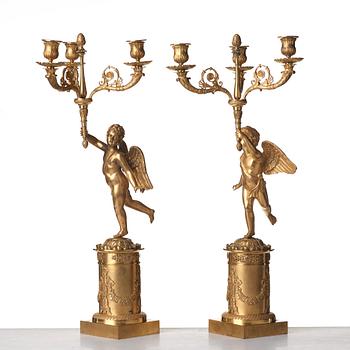 A pair of French Empire three-light candelabra, early 19th century.