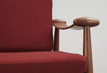 A pair of Finn Juhl teak easy chairs , model 133, France & Son, Denmark.
