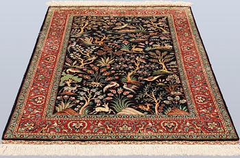 A Tabriz silk rug, approx. 155 x 100 cm.