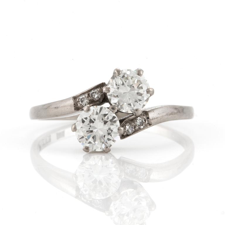 A cross-over ring set with round, brilliant-cut diamonds.