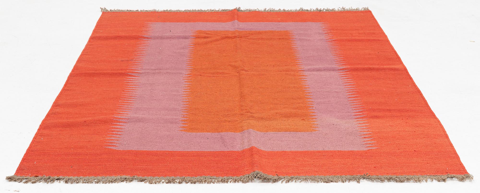 A persian kilim rug, approximately 243 x 179 cm.