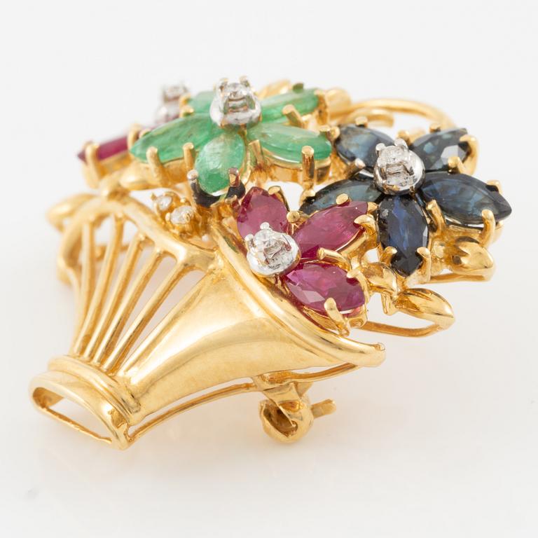 Brooch 18K gold set with round brilliant-cut diamonds as well as emeralds, sapphires, and rubies.