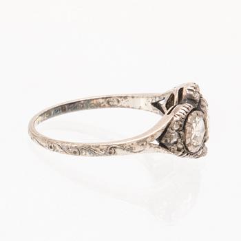 An 18K white gold ring set with rose cut diamonds.