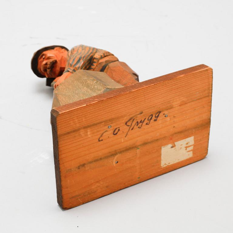 A signed wooden sculpture by CARL OLOF TRYGG.