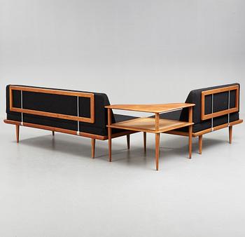 A set of two Danish 'Minerva' sofas with a table for France & Daverkosen.