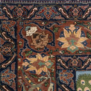 A carpet, semi-antique, Tabriz, signed, ca 271 x 175 cm.