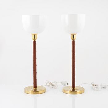A matched pair of model E 1251 table lamps from ASEA, mid 20th Century.