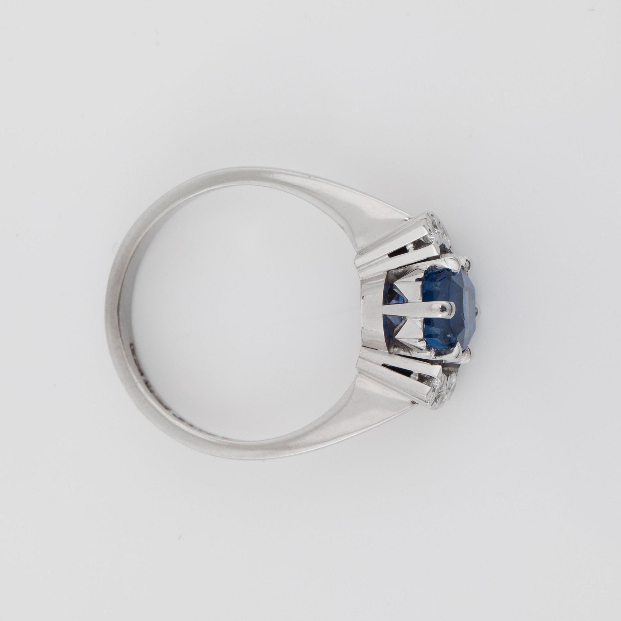 A sapphire and brilliant-cut diamond ring.