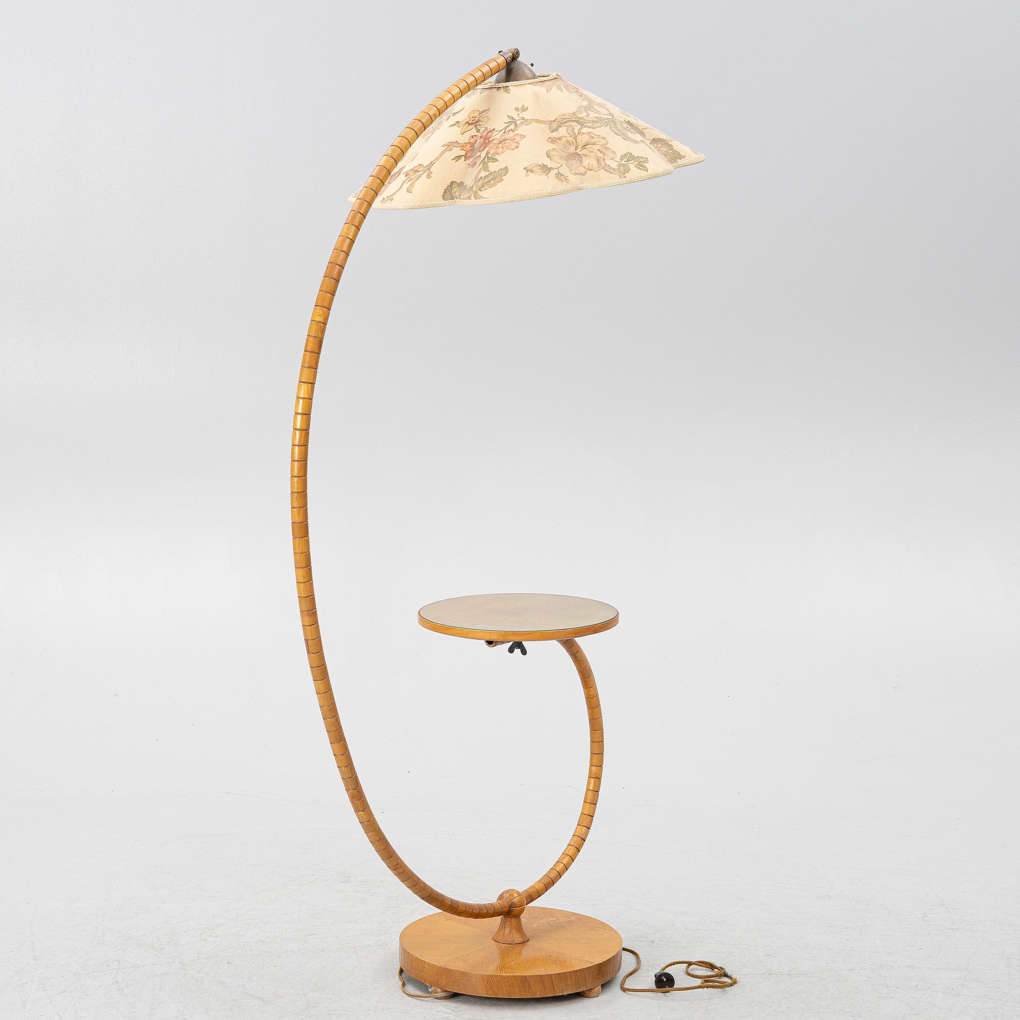 A 1930's/40's floor lamp with table.