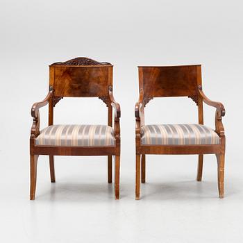 A pair of Russian carved mahogany Empire armchairs, first half of the 19th Century.