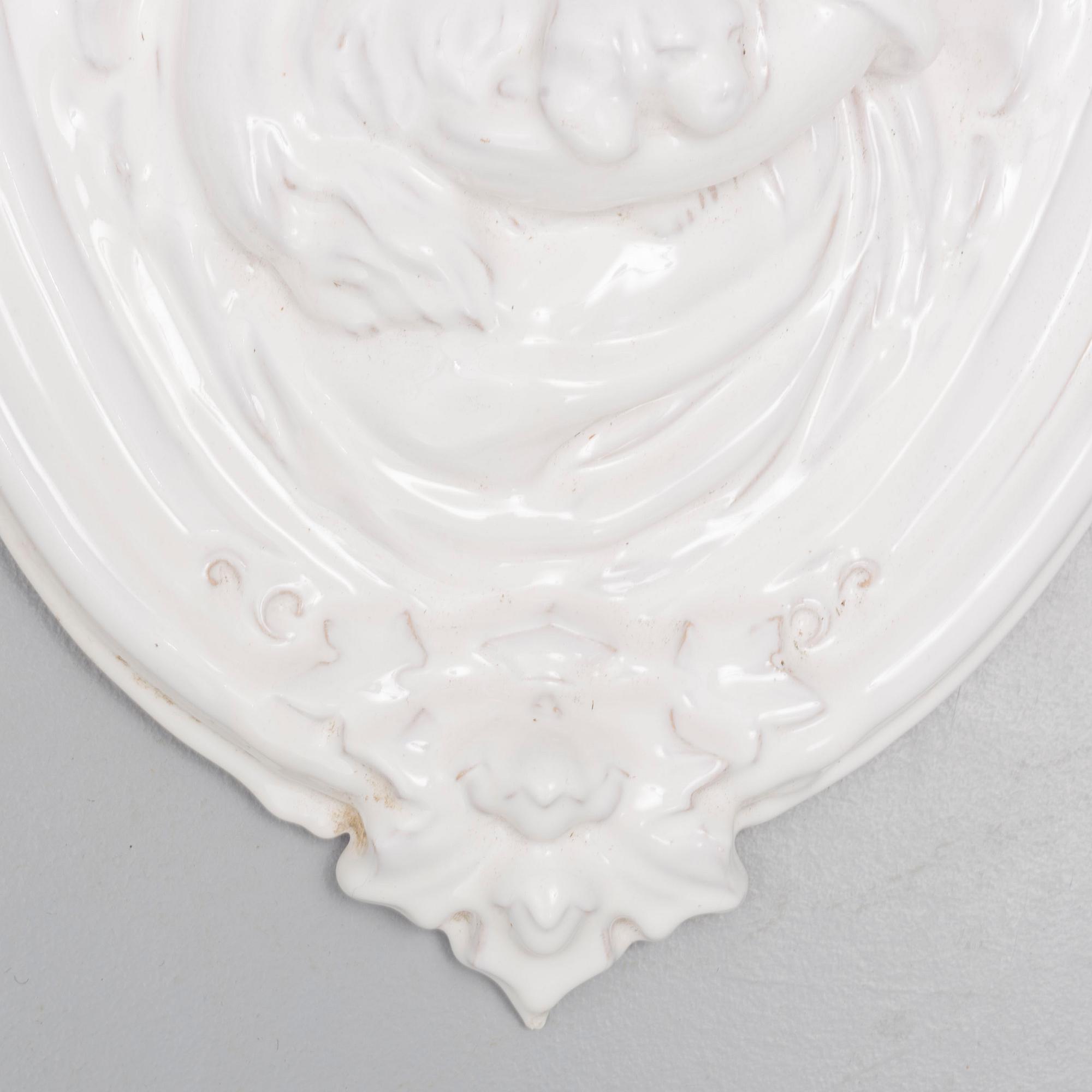 A ceramic wall relief, circa 1900.