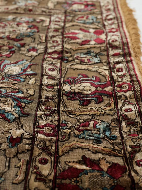 A carpet, an antique silk metal brocaded Kashan, probably around 1910, ca 200-202,5 x 129-131 cm.