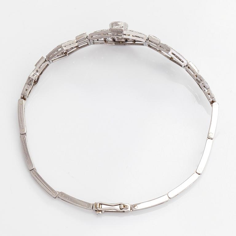 A platinum bracelet, set with brilliant- and single-cut diamonds.