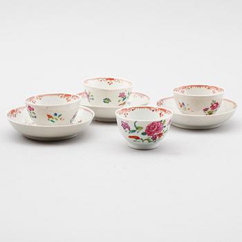 Set of three famille rose cups and saucers and a spare cup, 18th century.