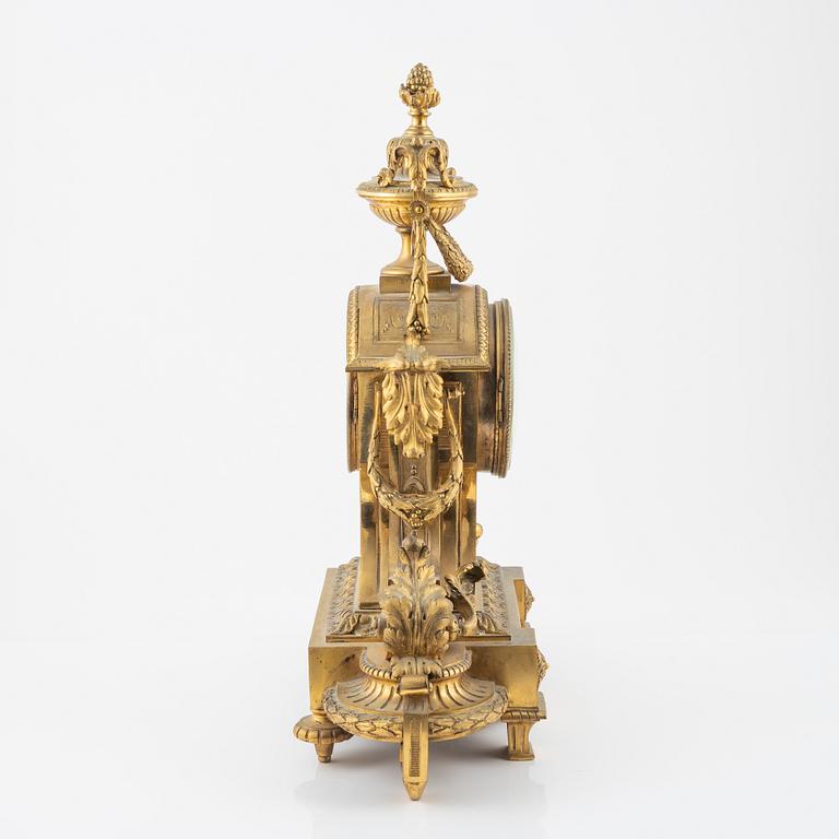 A Louis XVI-style gilt bronze mantel clock, 19th Century.