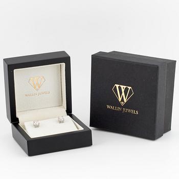 Brilliant-cut diamond stud earrings.