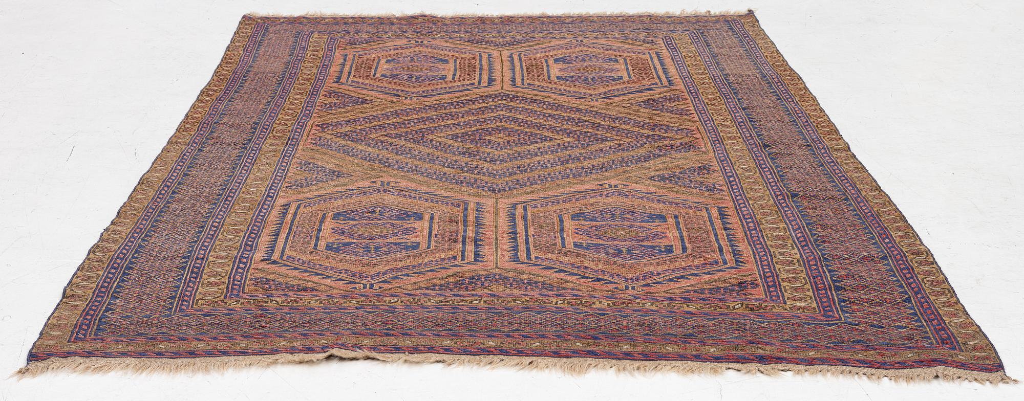An oriental rug, a. 198 x 130 cm.
