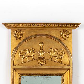 A giltwood Empire mirror by J. P. Holmberg (active in Stockholm 1813 - 1831).