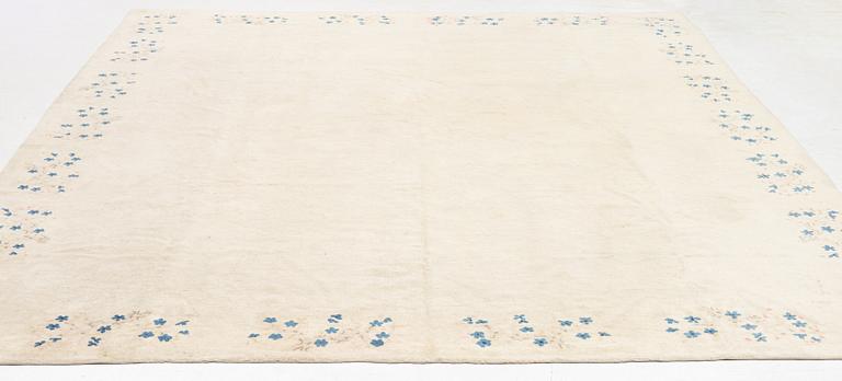 An Antique Peking rug, northern China, c 344 x 240 cm.