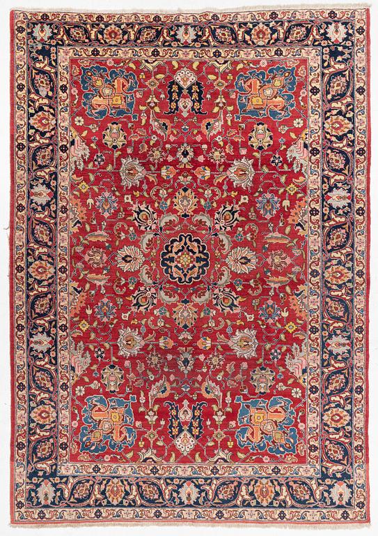 A semi-antique Tabriz carpet, c 358 x 248 cm.