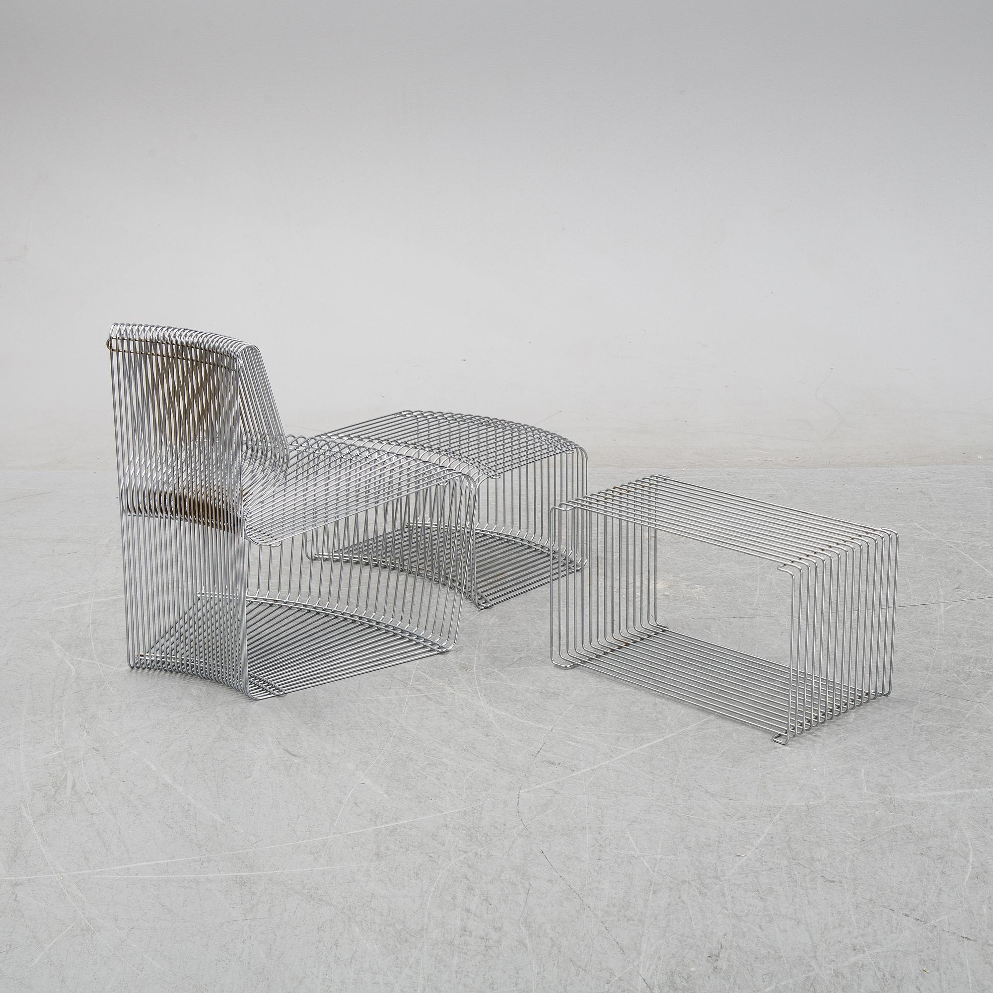 A 'Pantanova convex' chair with foot stool and a 'Wire Extendted' shelf, Verner Panton, Montana, Denmark.