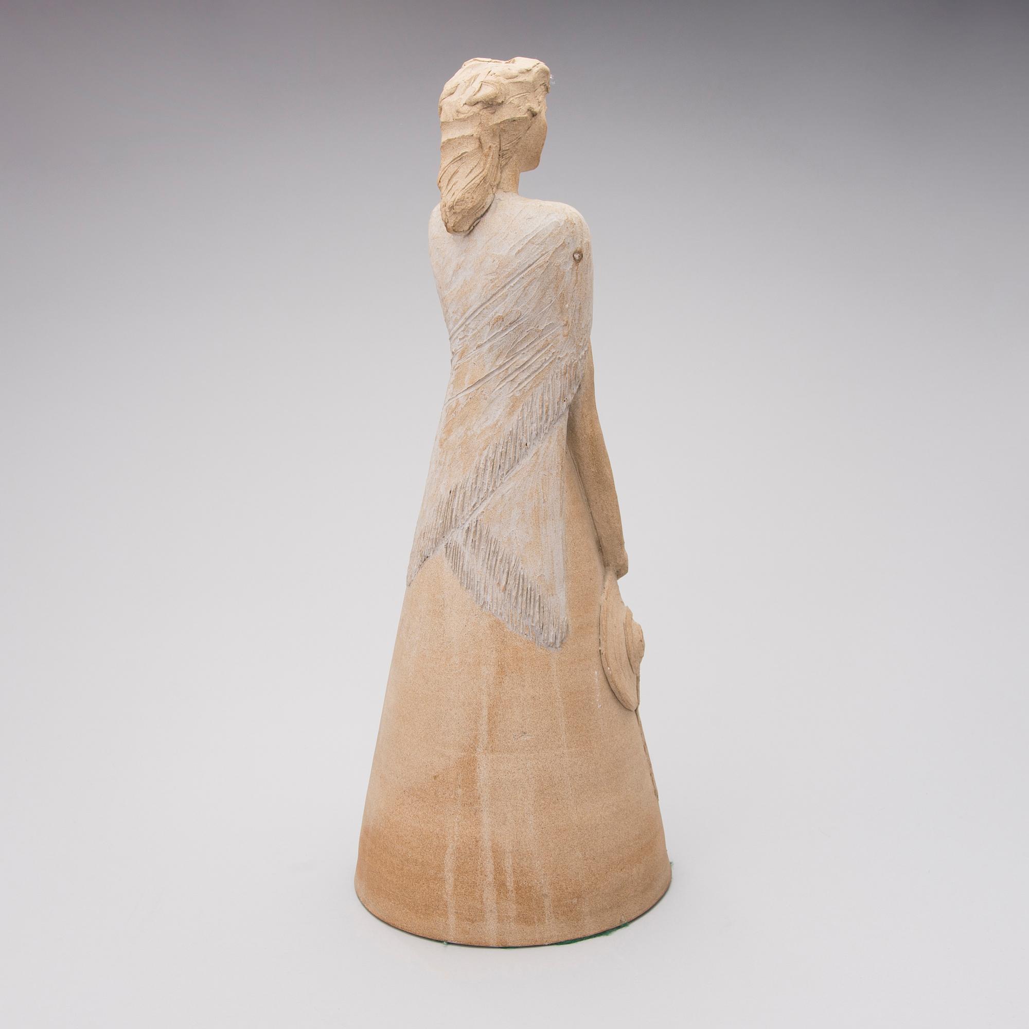 A signed stoneware sculpture.