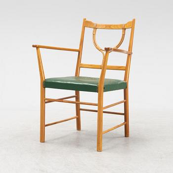 Josef Frank, a model 2238 cherry wood armchair by Firma Svenskt Tenn.