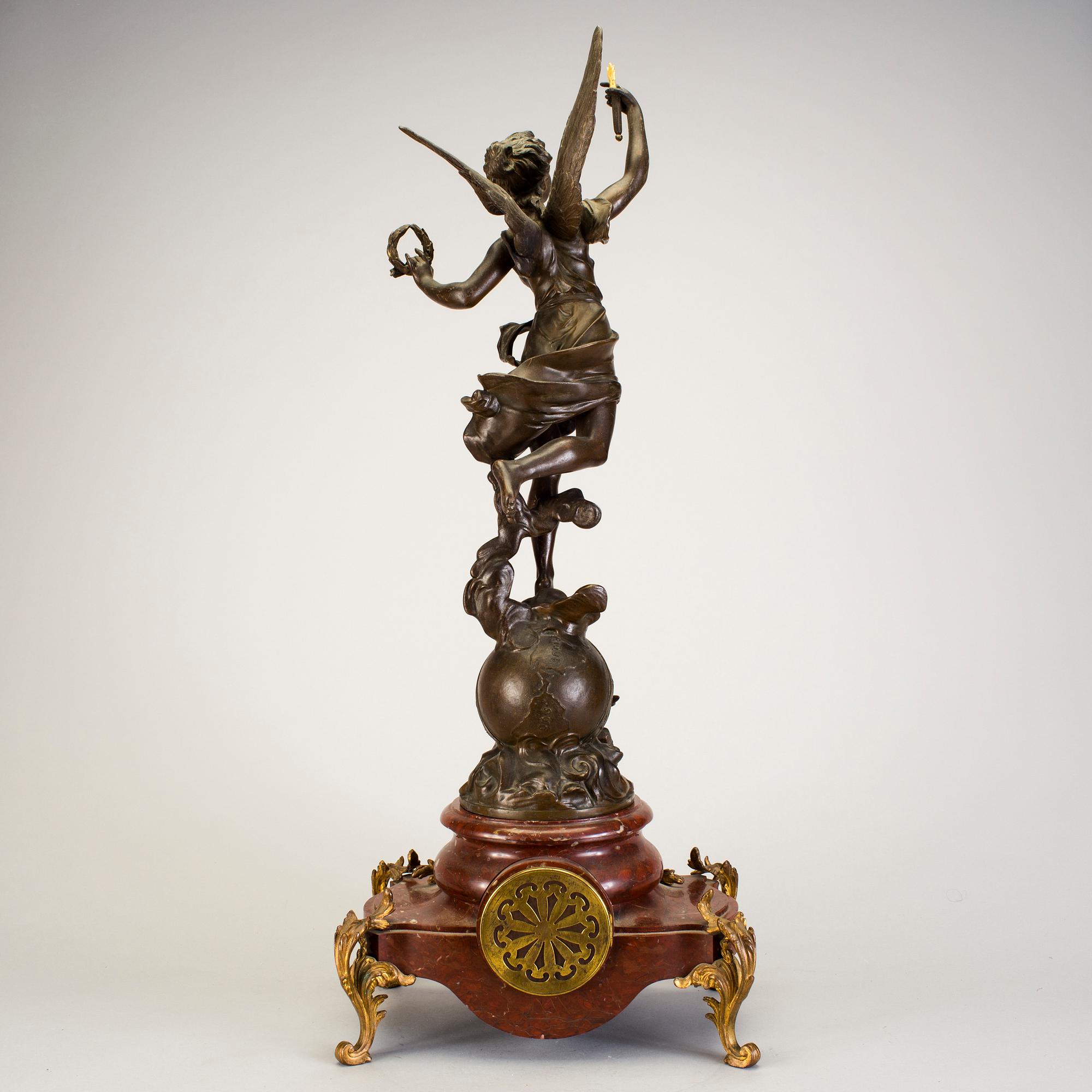 A mantel clock with sculpture "L'occident" after Émile Bruchon from the turn of the century 1800/1900.