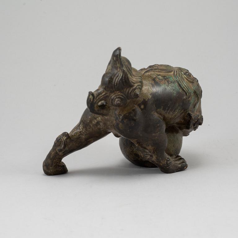 A bronze figure of a buddhist lion, Japan, 20th Century.