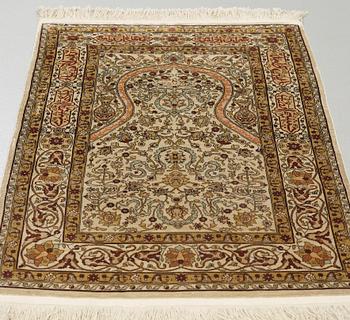A silk Hereke possibly, around 96 x 66 cm.