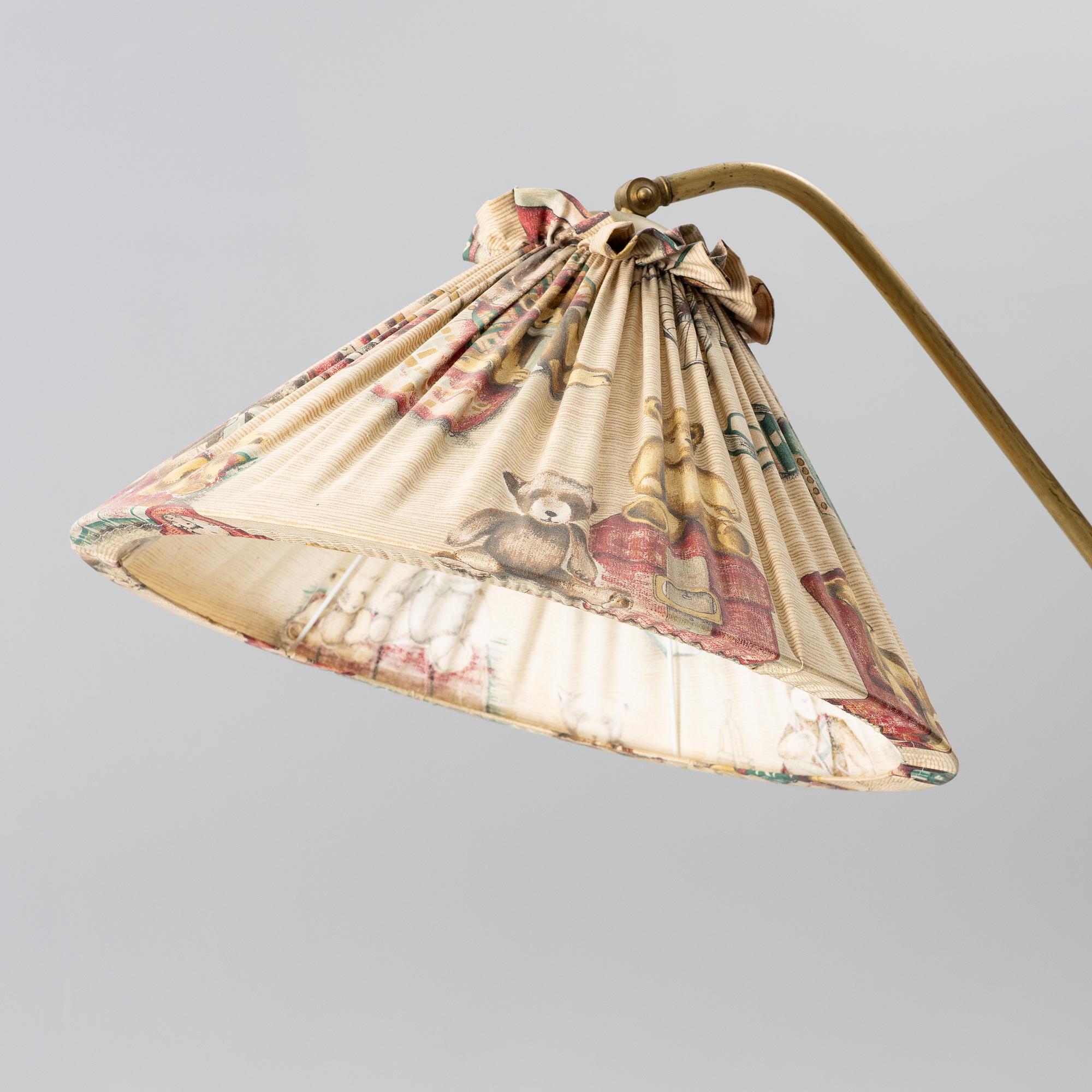 A 1940s Swedish Modern floor lamp.