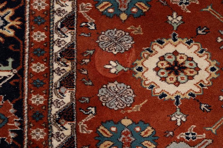 A semi-antique Orientall carpet c. 318 x 202 cm.