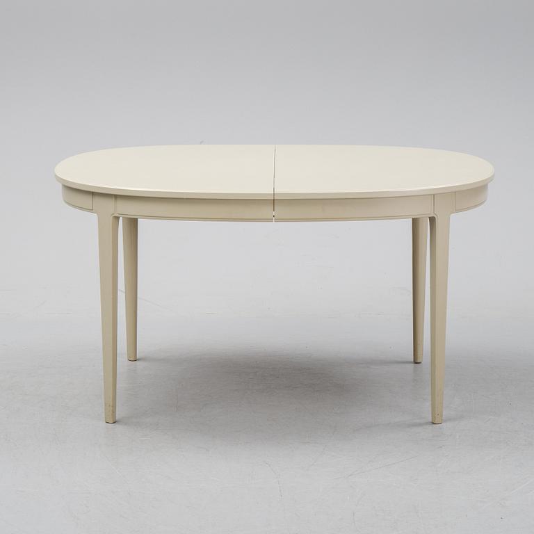 A dining table with six chairs by Carl Malmsten, second half of the 20th Century.