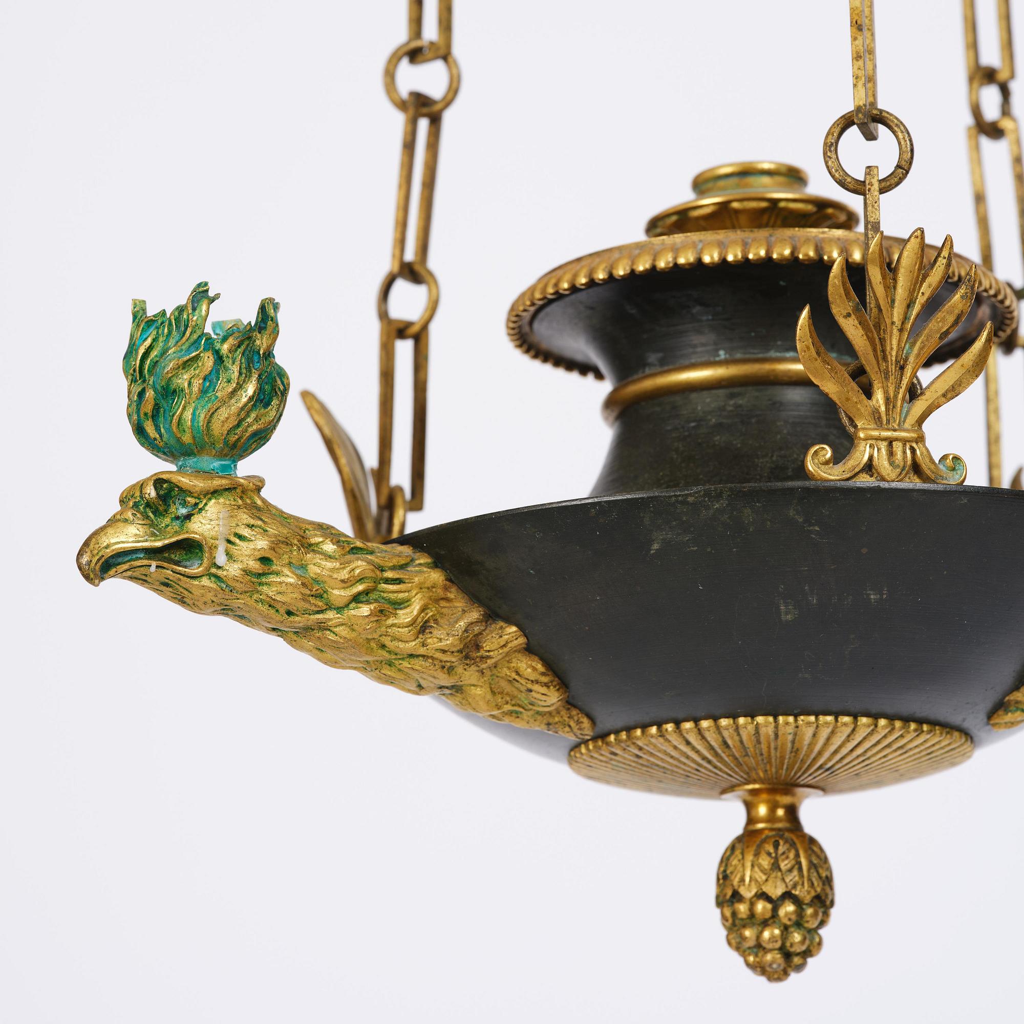 An Empire ormolu and patinated bronze four-light chandelier, Stockholm, early 19th century.