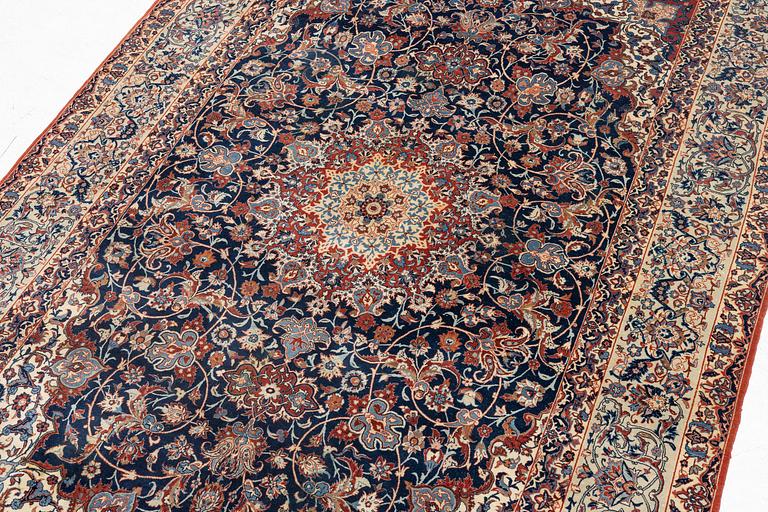 A semi-antique Isfahan rug, signed (Sadegh) Seirafian, c. 244 x 149 cm.