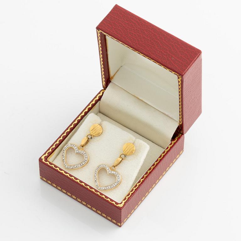 Earrings with hearts and small octagon-cut diamonds.
