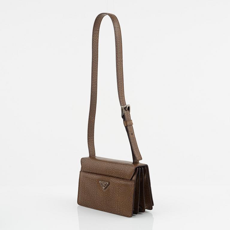 Prada, a brandy colored bag.