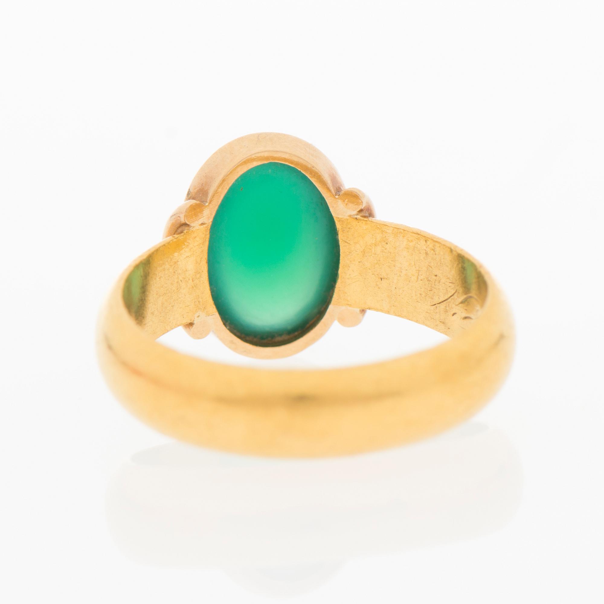 A RING, cabochon cut chalcedony, 23K gold. Turku Finland 1906.