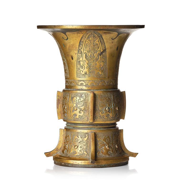 A parcel gilt/gold splashed bronze vase, Gu, 17/18th century.